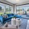 picture windows surround lounge area in clubhouse