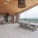 a patio with a table and chairs
