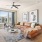 living room with oversized window and built-in bookshelves