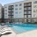 outdoor pool surrounded by lounge chairs