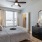 Luxury bedroom with a large mirror at urban East apartments in East Austin.