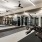 large room with lots of exercise equipment