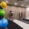 room with exercise equipment and brick wall